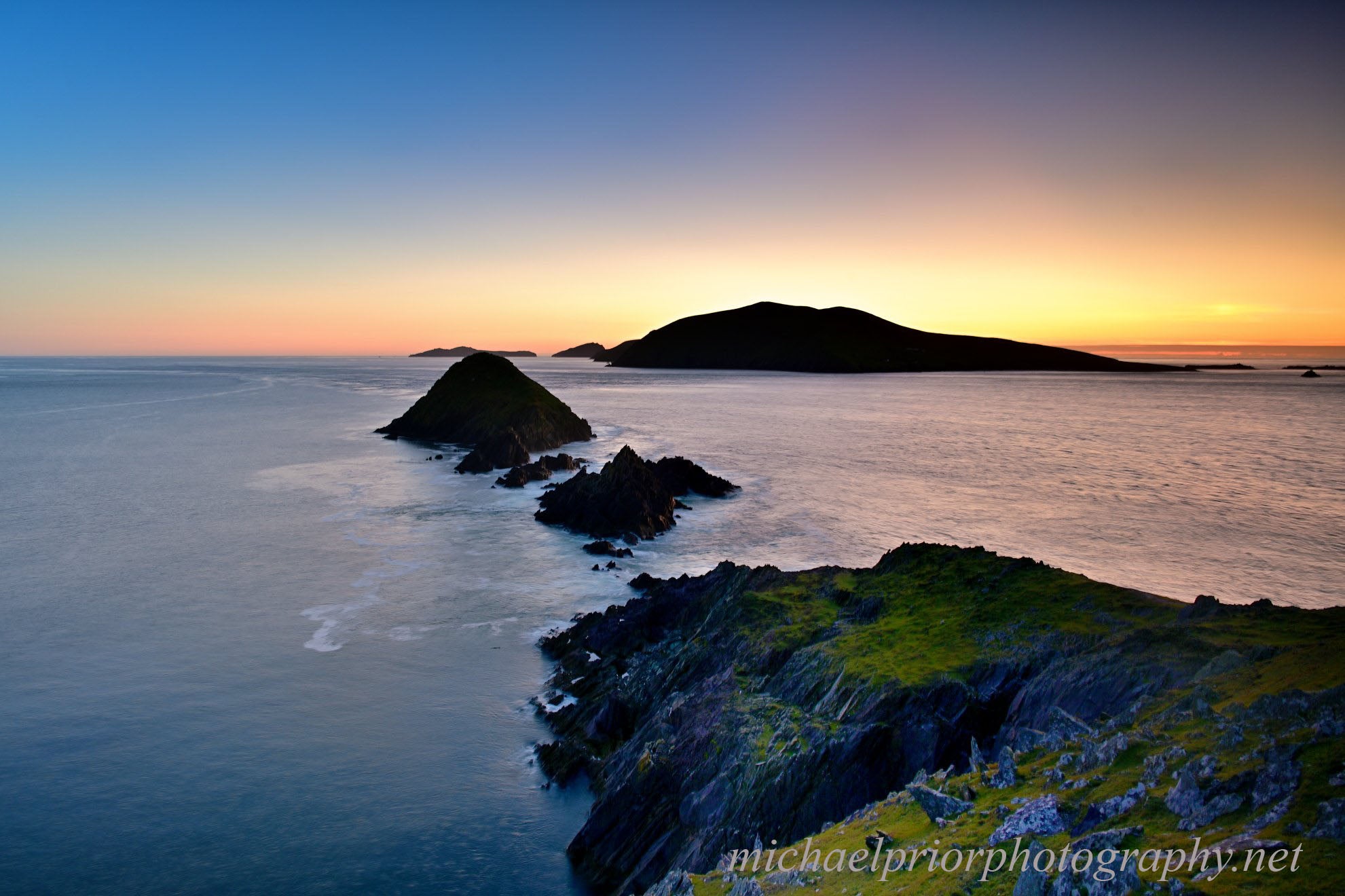 Dunmore head and the Great Blasket Island at sunset.