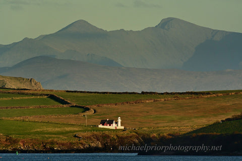 Dingle lighthouse with Carauntoohill in the distance