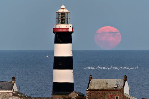 Full moon on the horizon at the Oldhead of Kinsale