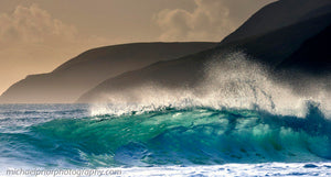 The Sun shining Through A Wave With The Blasket Islands In The Background.